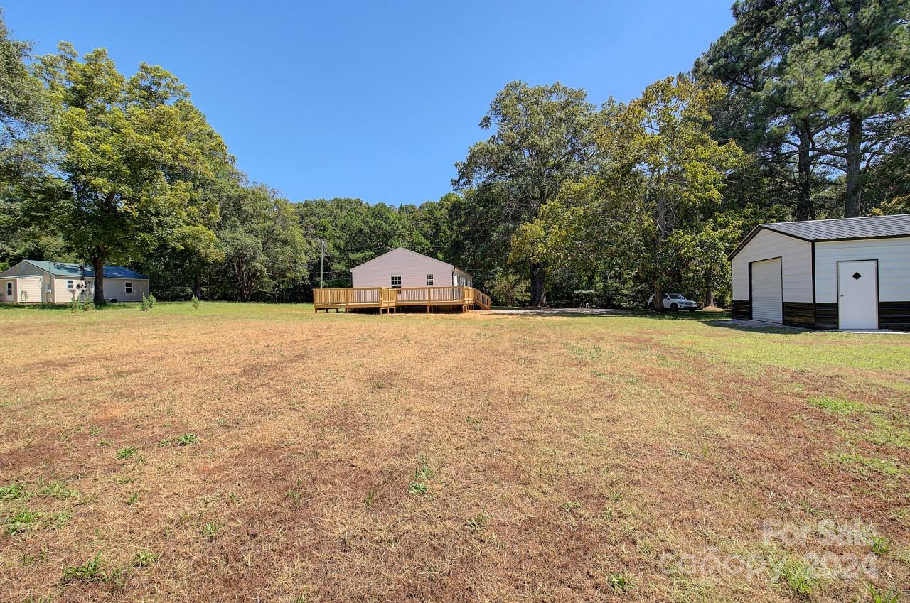6130 Hopewell Road Hickory Grove, SC 29717 - Photo 29 of 29 a view of white house with a yard