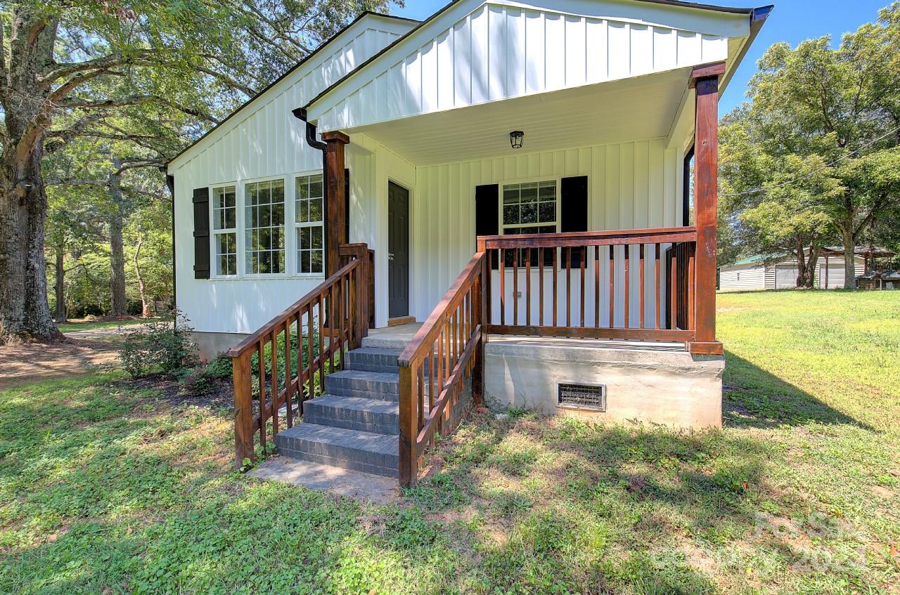 6130 Hopewell Road Hickory Grove, SC 29717 - Photo 3 of 29 a view of a house with backyard and deck