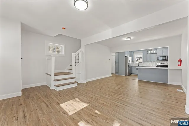 a view of kitchen and wooden floor