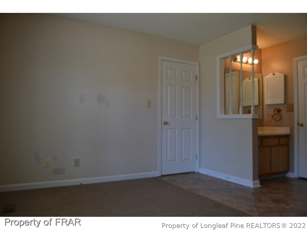 3326 Annawood Court Spring Lake, NC 28390 - Photo 13 of 19 a view of an empty room and a bathroom