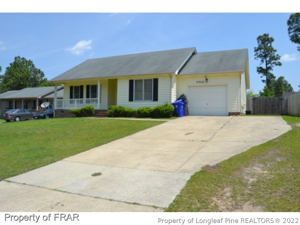 3326 Annawood Court Spring Lake, NC 28390 - Photo 2 of 19 a view of house with garden space and street view
