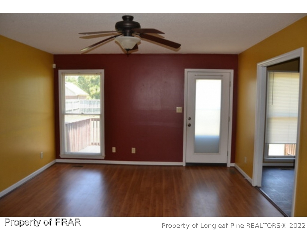 3326 Annawood Court Spring Lake, NC 28390 - Photo 7 of 19 a view of an empty room with wooden floor and a window