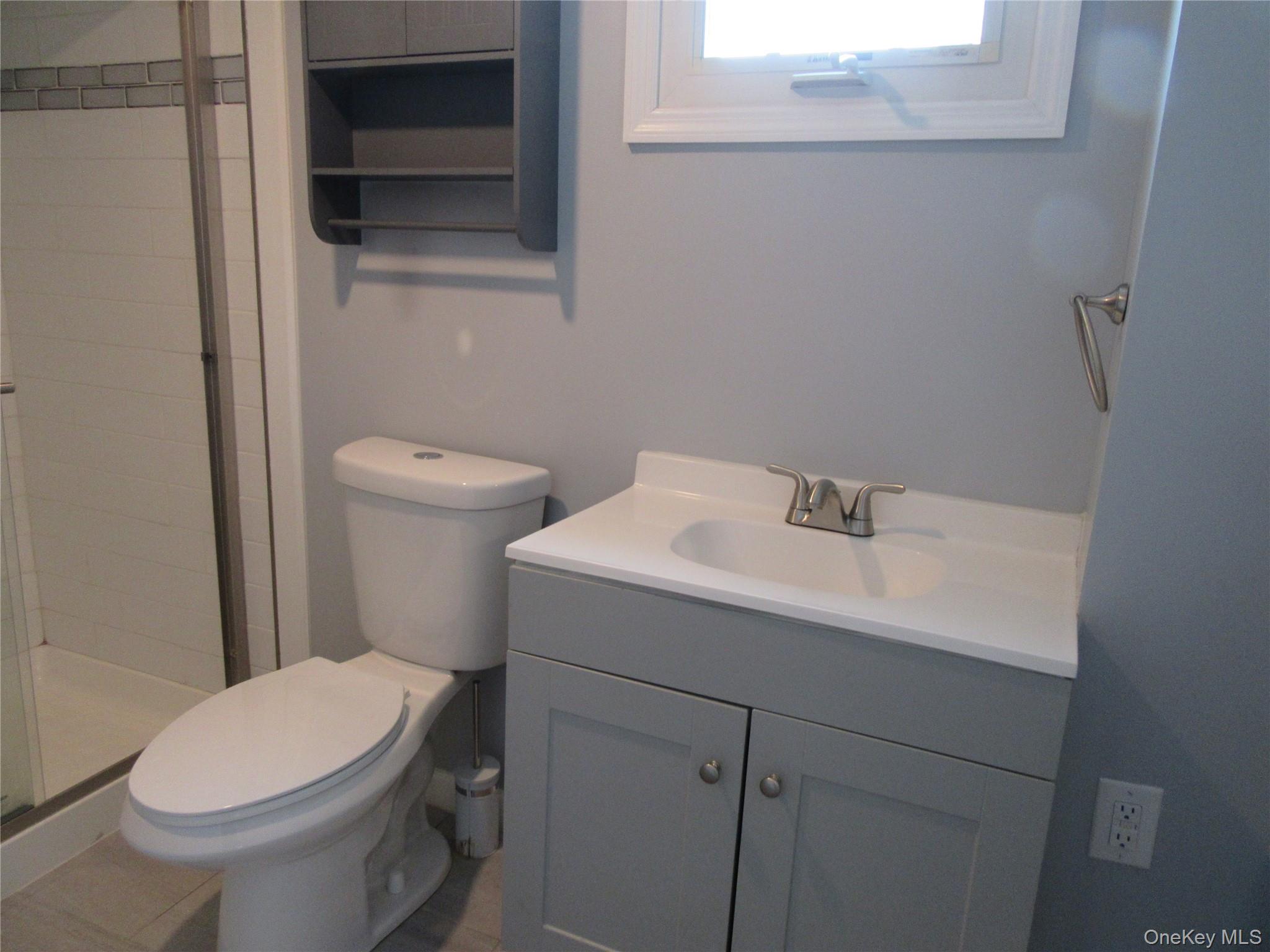 13 West Main Street, Unit 2A Washingtonville, NY 10992 - Photo 13 of 13 Bathroom with vanity and a stall shower