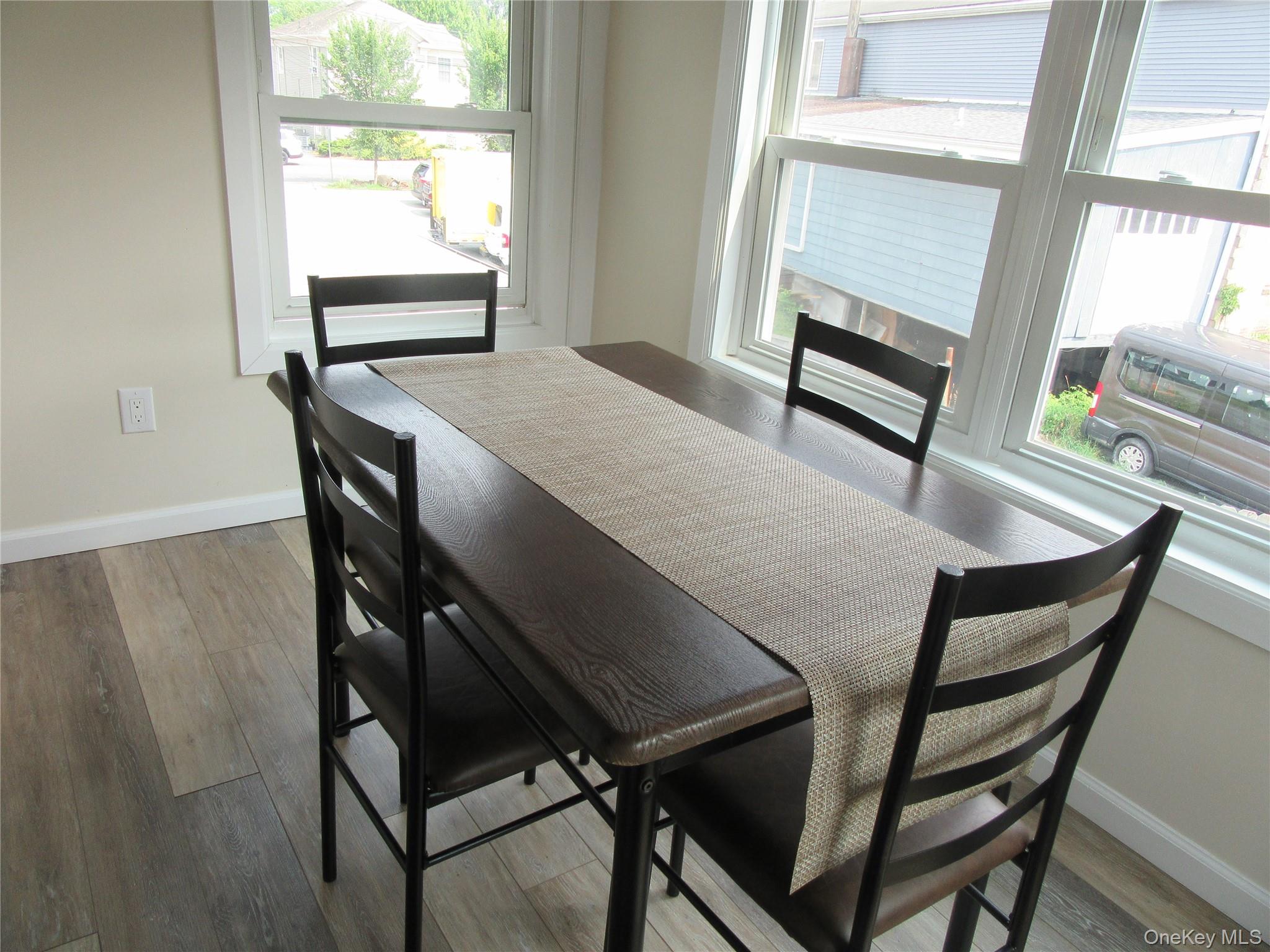 13 West Main Street, Unit 2A Washingtonville, NY 10992 - Photo 9 of 13 Dining room with healthy amount of natural light and wood finished floors