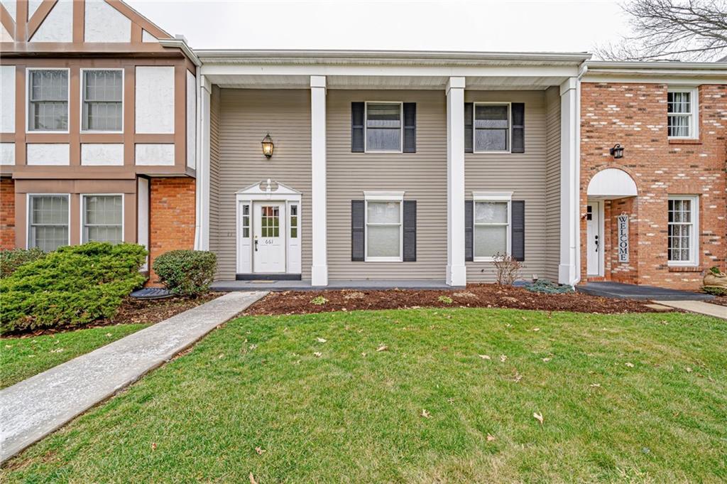 front view of a house with a yard