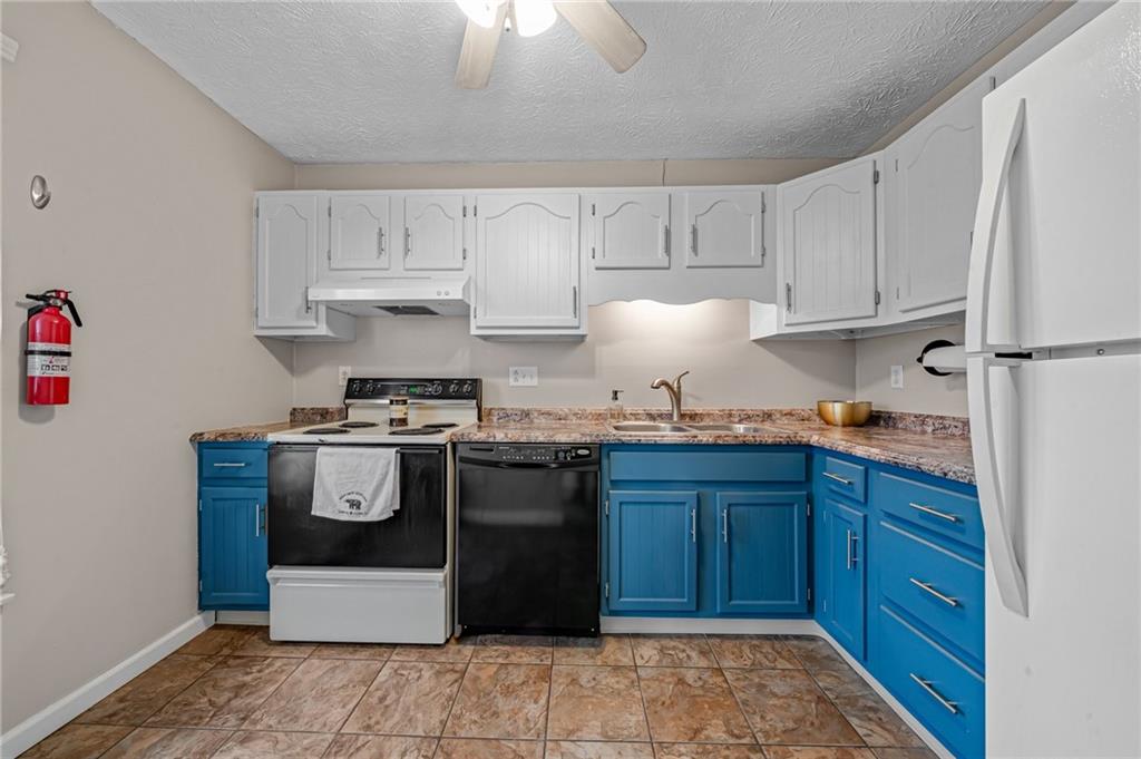 661 Georgetown Village Indiana, PA 15701 - Photo 14 of 25 a kitchen with granite countertop cabinets and steel stainless steel appliances