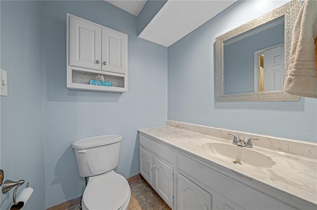 661 Georgetown Village Indiana, PA 15701 - Photo 17 of 25 a bathroom with a toilet sink and mirror