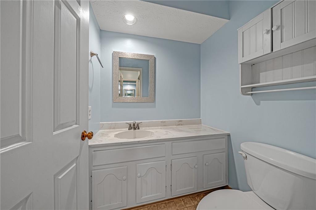 661 Georgetown Village Indiana, PA 15701 - Photo 19 of 25 a bathroom with a toilet sink vanity and mirror