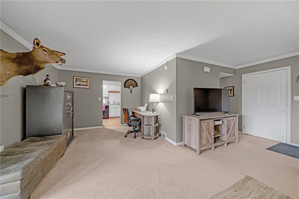 661 Georgetown Village Indiana, PA 15701 - Photo 3 of 25 a view of a livingroom with a flat screen tv and furniture