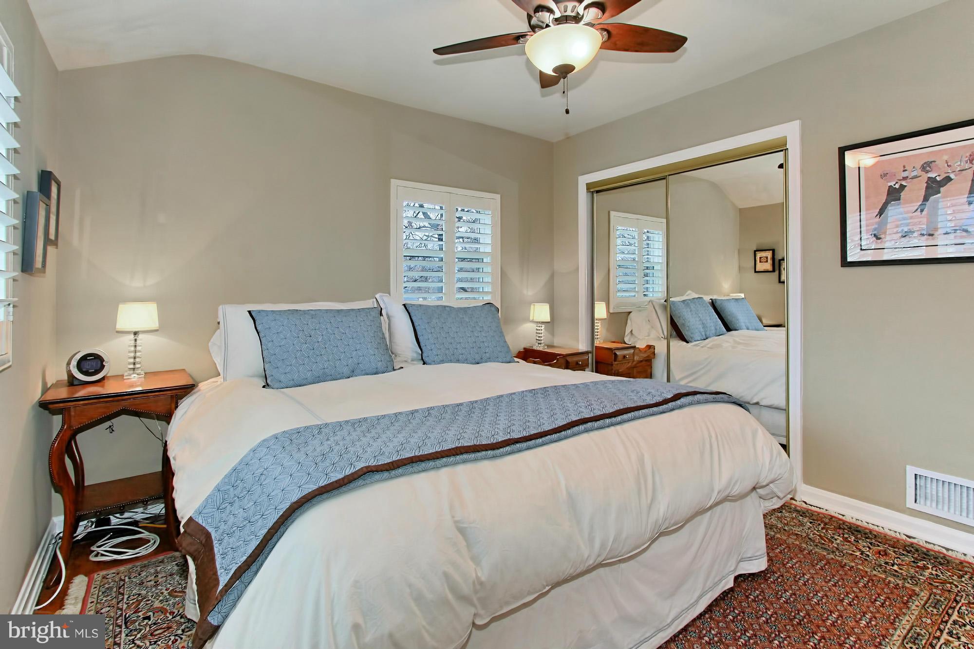 216 East Spring Street Alexandria, VA 22301 - Photo 13 of 30 Master bedroom with wood floors and large windows