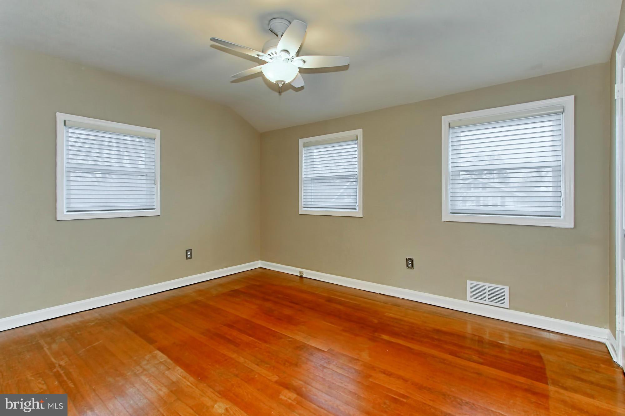 216 East Spring Street Alexandria, VA 22301 - Photo 14 of 30 2nd bedroom large windows and wood floors