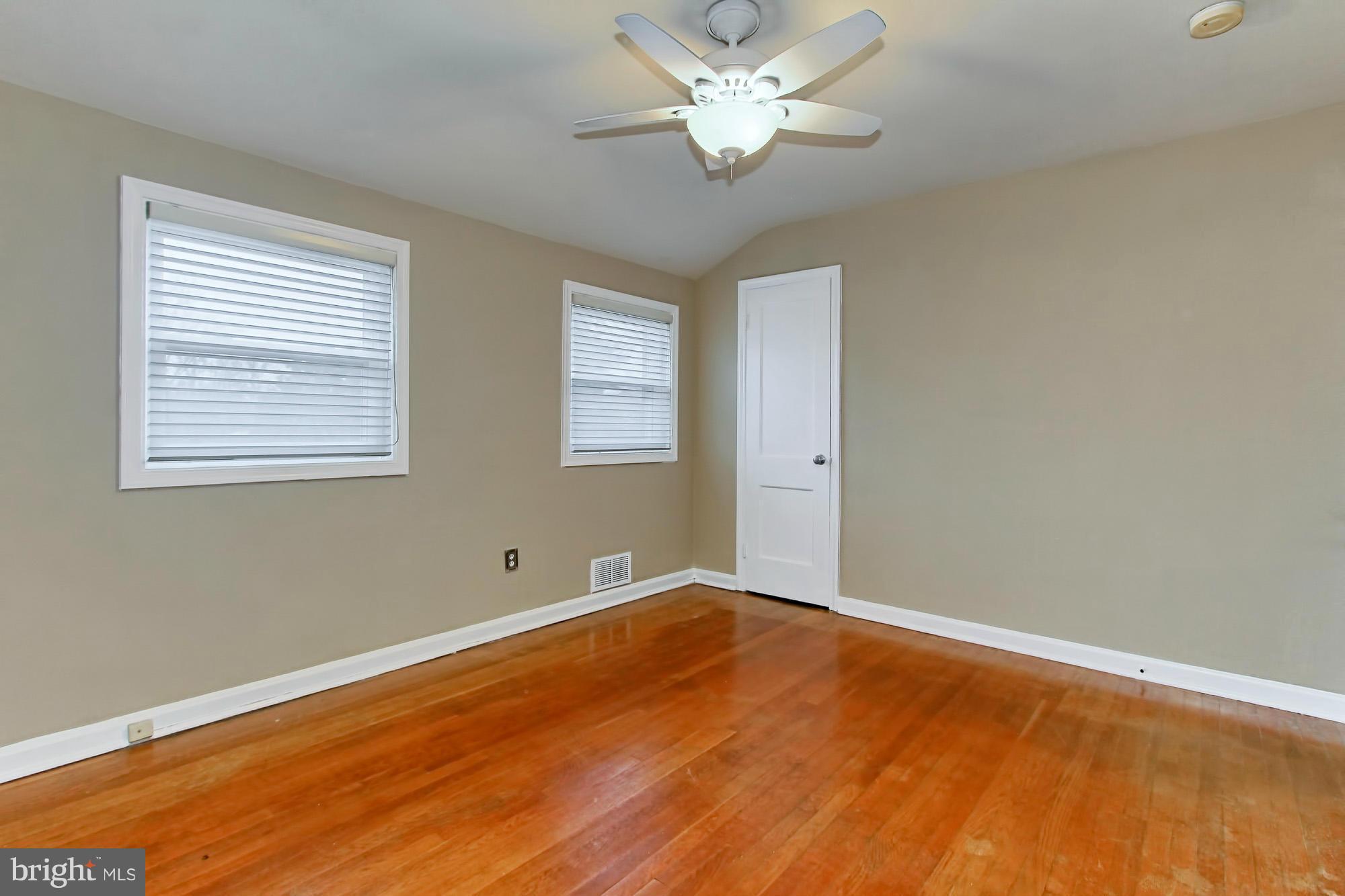216 East Spring Street Alexandria, VA 22301 - Photo 15 of 30 2nd bedroom large windows and wood floors