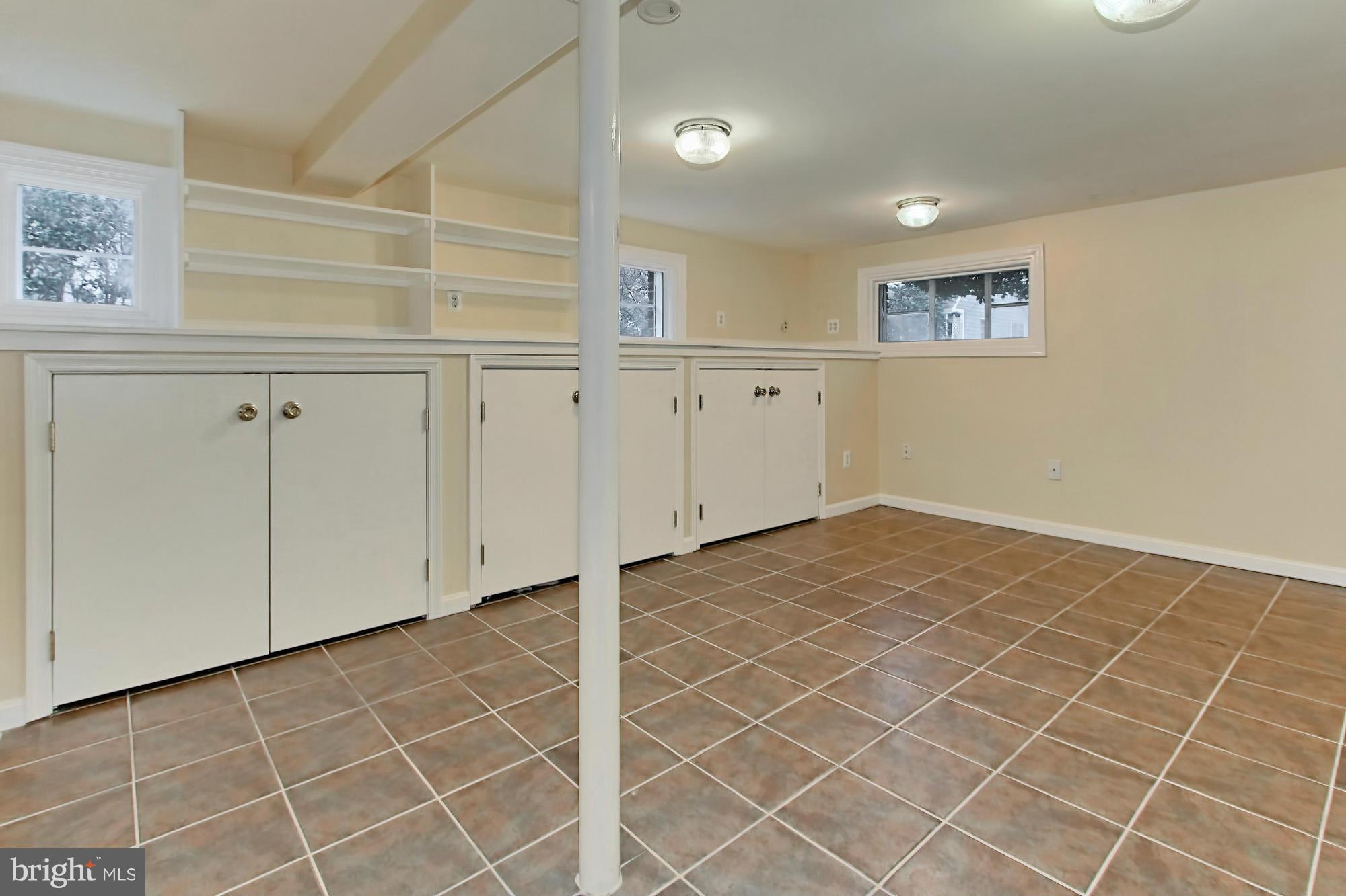 216 East Spring Street Alexandria, VA 22301 - Photo 18 of 30 Built-in cabinets and earth-toned tiles
