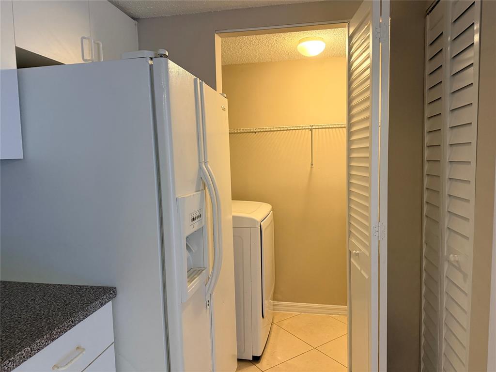 5025 Wiles Road, Unit 101 Coconut Creek, FL 33073 - Photo 8 of 27 a bathroom with a shower and a sink