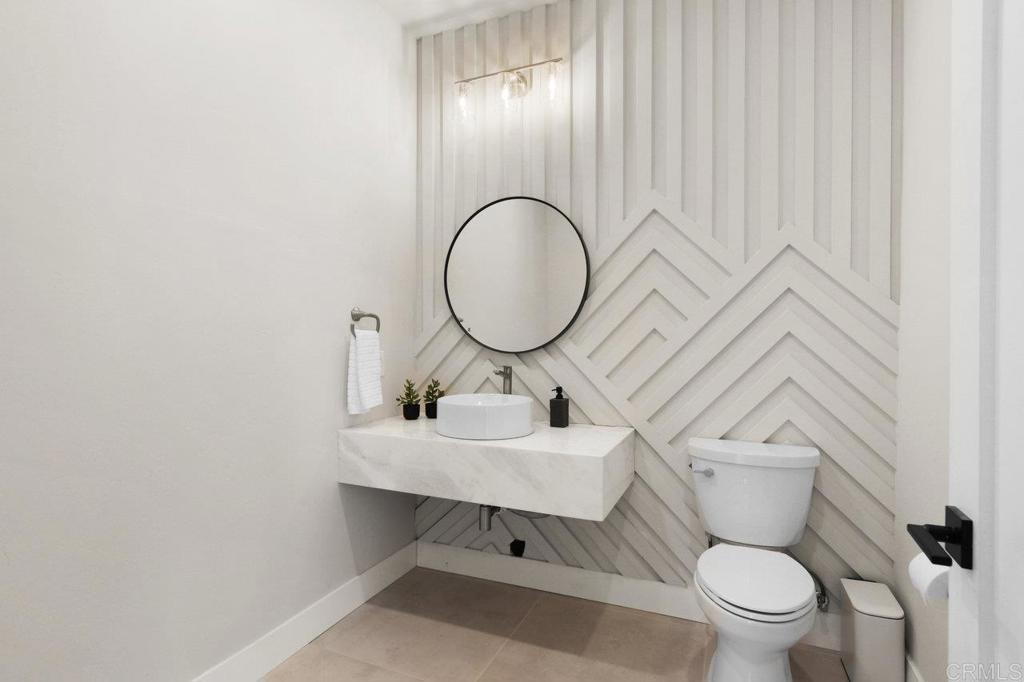 573 Lilac Ranch Road Alpine, CA 91901 - Photo 23 of 47 a bathroom with a toilet a sink and a mirror