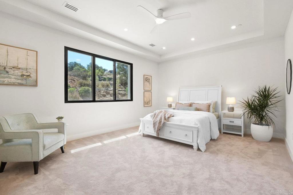 573 Lilac Ranch Road Alpine, CA 91901 - Photo 24 of 47 a spacious bedroom with a bed and glass window