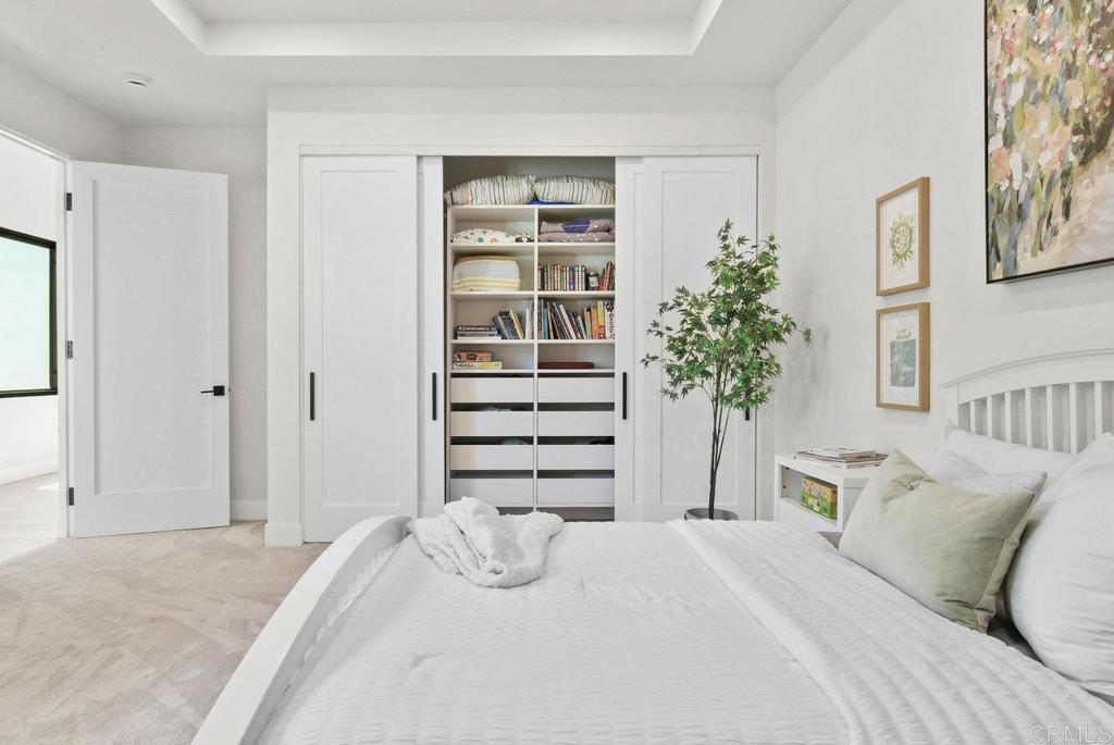 573 Lilac Ranch Road Alpine, CA 91901 - Photo 27 of 47 a bedroom with a bed and a closet