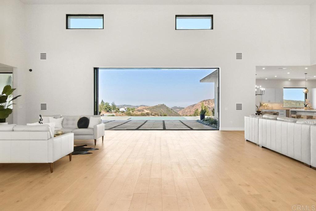 573 Lilac Ranch Road Alpine, CA 91901 - Photo 3 of 47 a living room with furniture and a flat screen tv