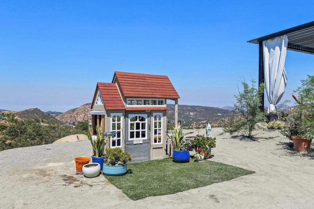573 Lilac Ranch Road Alpine, CA 91901 - Photo 42 of 47 a front view of a house with a yard