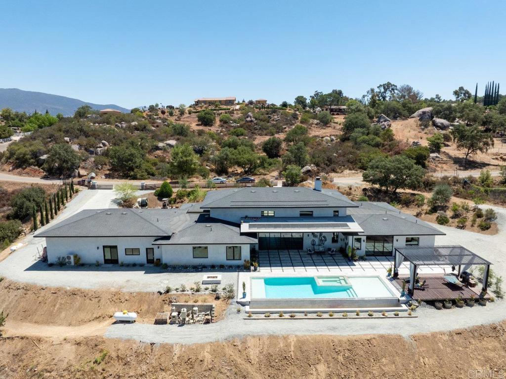 573 Lilac Ranch Road Alpine, CA 91901 - Photo 44 of 47 a view of a big house in front of a road