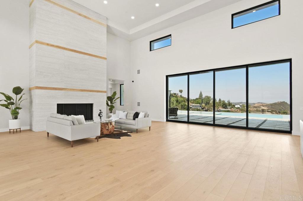 573 Lilac Ranch Road Alpine, CA 91901 - Photo 5 of 47 a living room with furniture and a fireplace