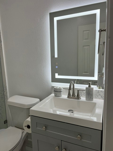 4219 Hirschfield Road Spring, TX 77373 - Photo 21 of 25 Secondary Bathroom with lighted mirror