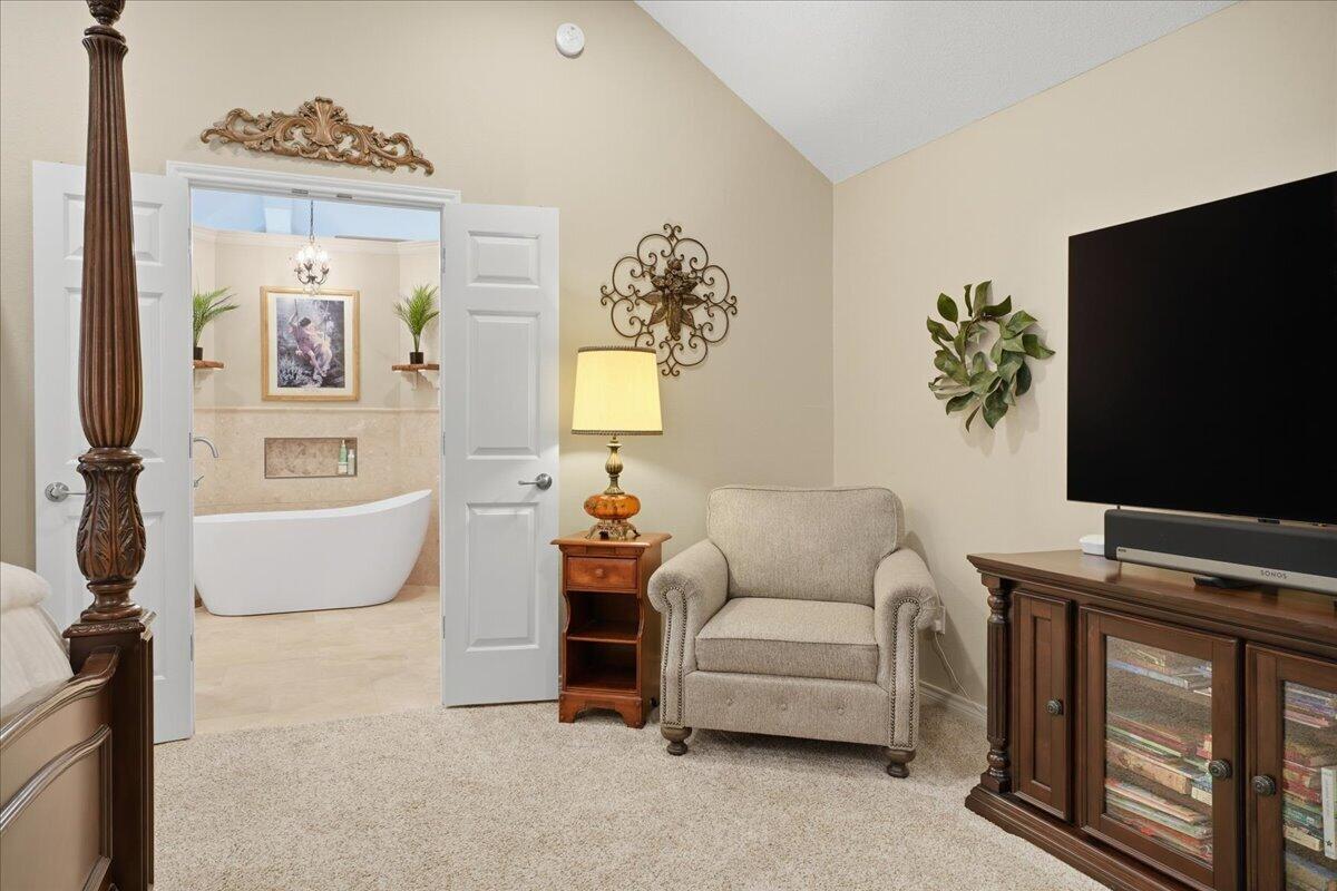 4612 100th Street Lubbock, TX 79424 - Photo 28 of 55 a living room with furniture and a flat screen tv