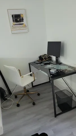 a view of a workspace with furniture