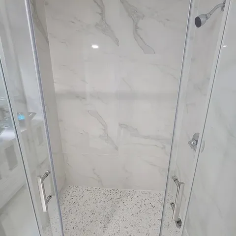 a bathroom with double vanity and a sink