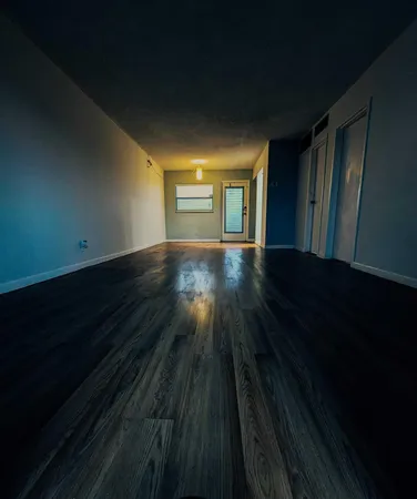 a room with cabinets and wooden floor