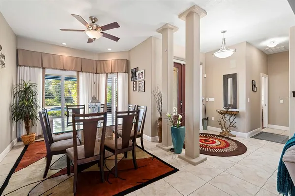 a kitchen with stainless steel appliances kitchen island granite countertop a refrigerator and a stove top oven