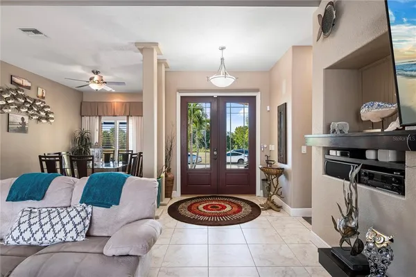 a kitchen with stainless steel appliances granite countertop a sink and a refrigerator