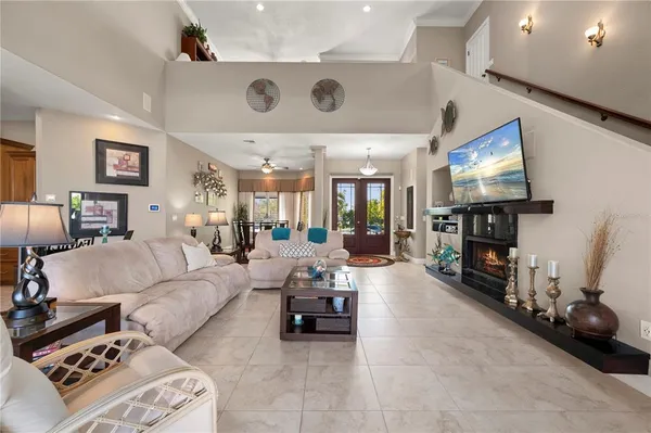 a bathroom with a granite countertop sink a toilet a mirror and shower