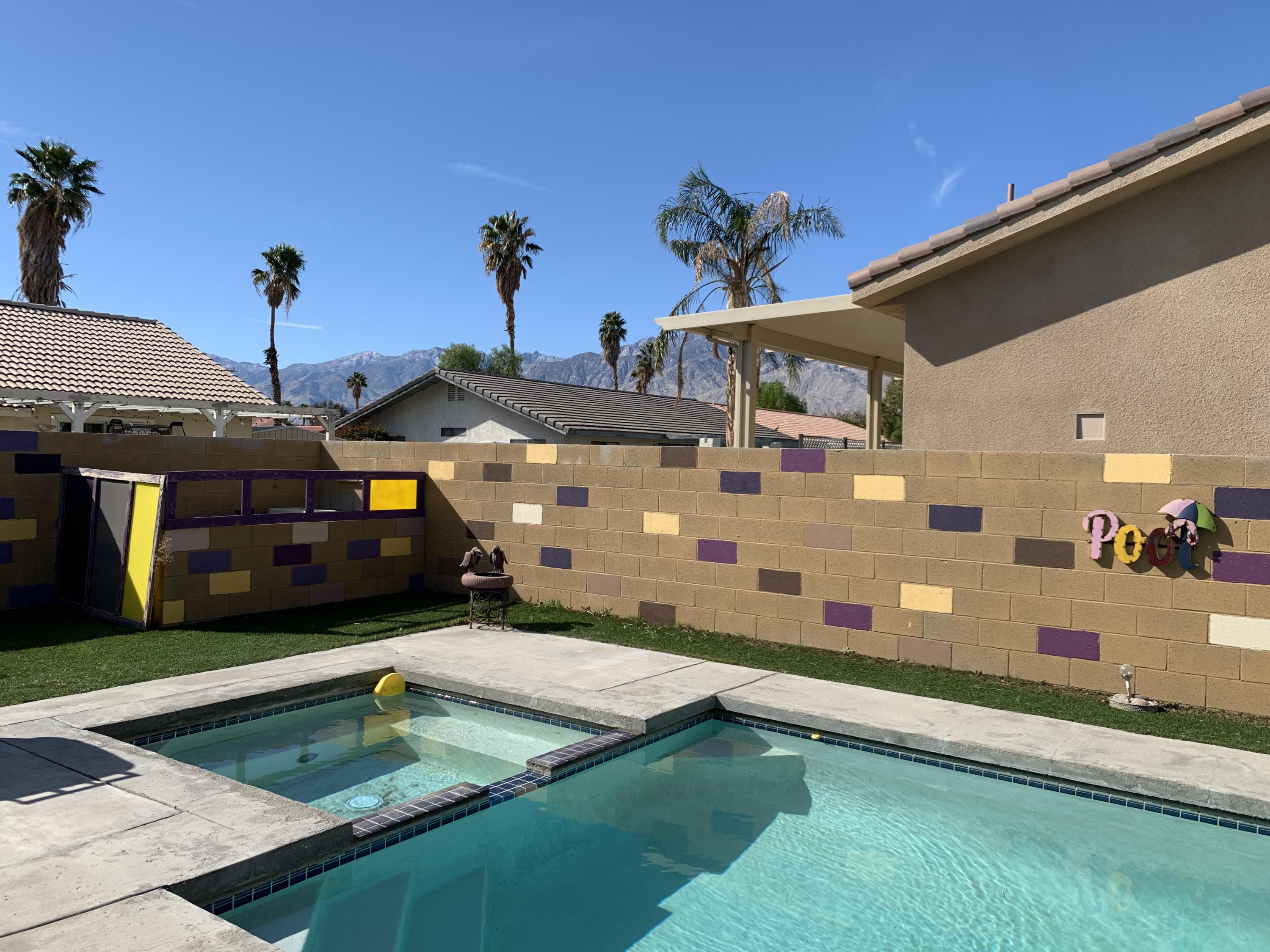 67725 Garbino Road Cathedral City, CA 92234 - Photo 2 of 16 a view of a house with swimming pool