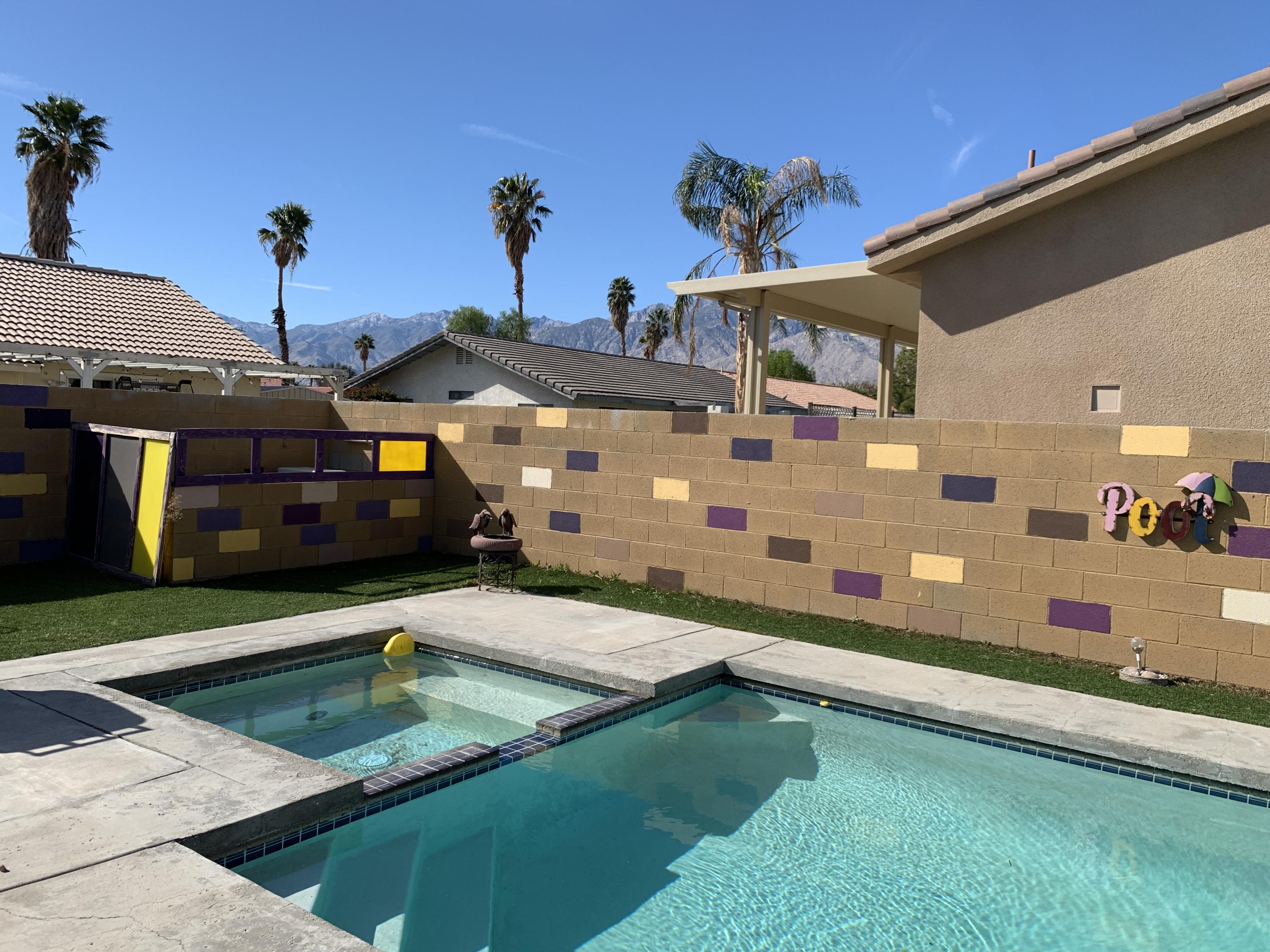 67725 Garbino Road Cathedral City, CA 92234 - Photo 12 of 16 a view of a house with swimming pool