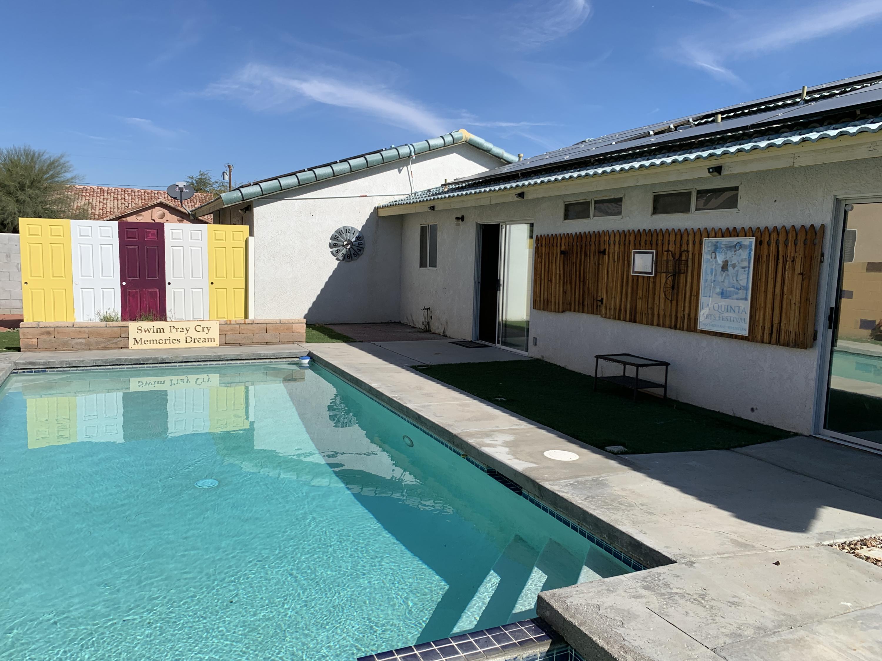67725 Garbino Road Cathedral City, CA 92234 - Photo 13 of 16 a house view with a swimming pool