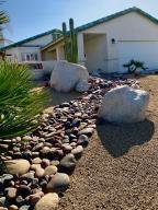 67725 Garbino Road Cathedral City, CA 92234 - Photo 14 of 16 a backyard of a house with lots of green space