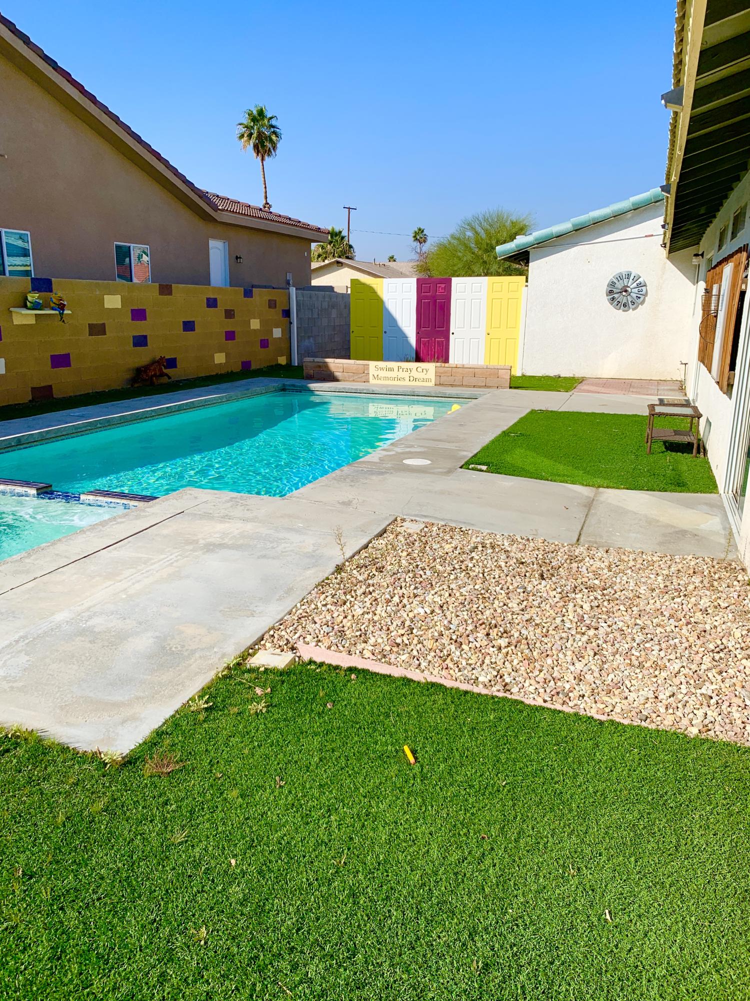 67725 Garbino Road Cathedral City, CA 92234 - Photo 16 of 16 a front view of a house with a yard and garage