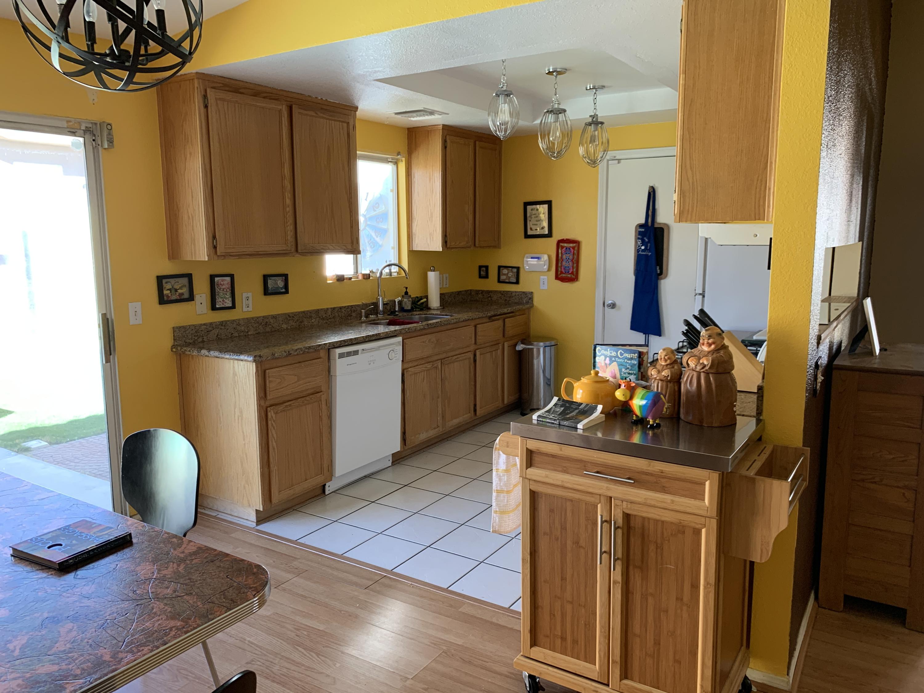 67725 Garbino Road Cathedral City, CA 92234 - Photo 7 of 16 a kitchen with a sink appliances and cabinets