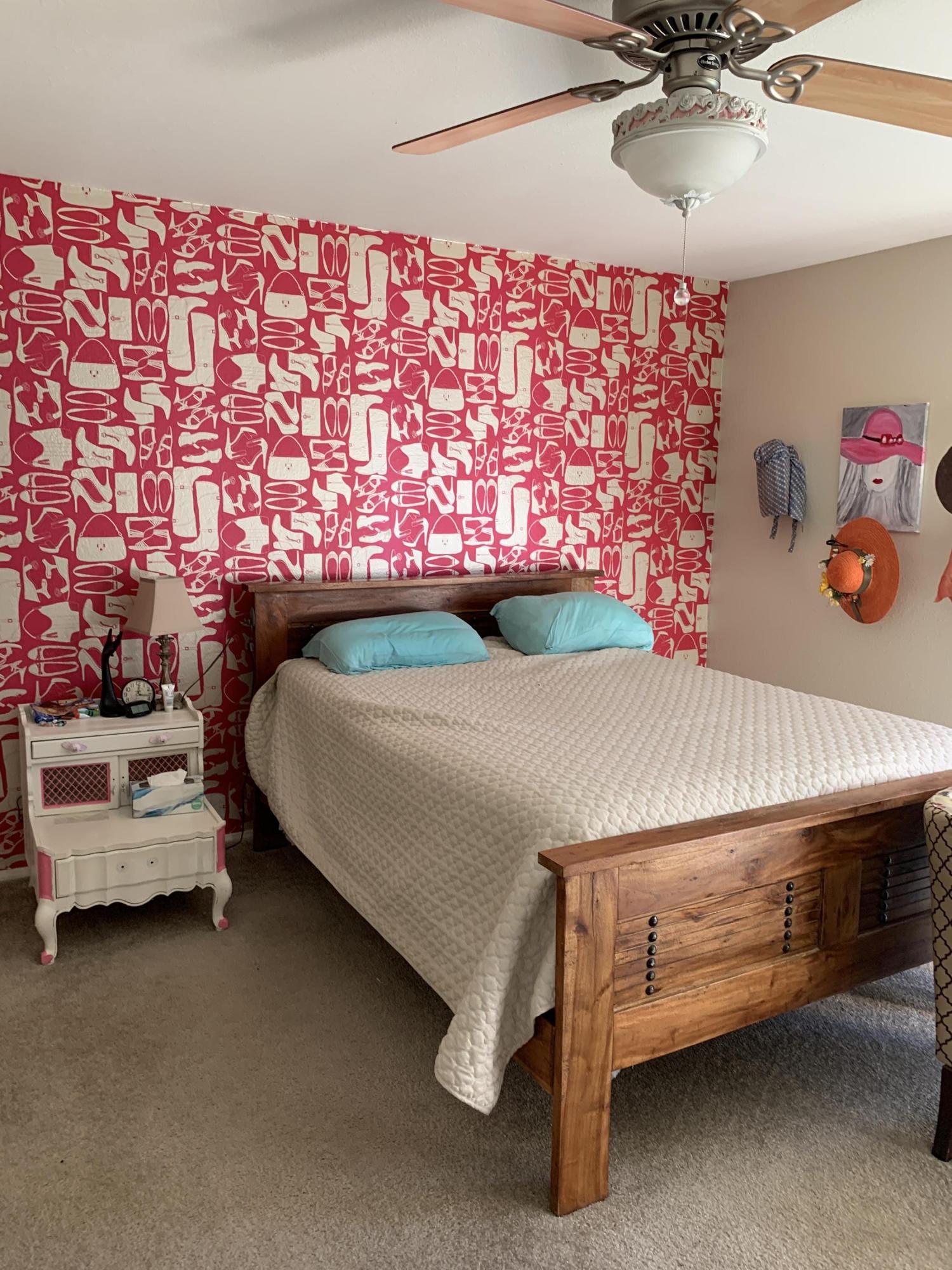 67725 Garbino Road Cathedral City, CA 92234 - Photo 9 of 16 a bedroom with a bed and a chandelier