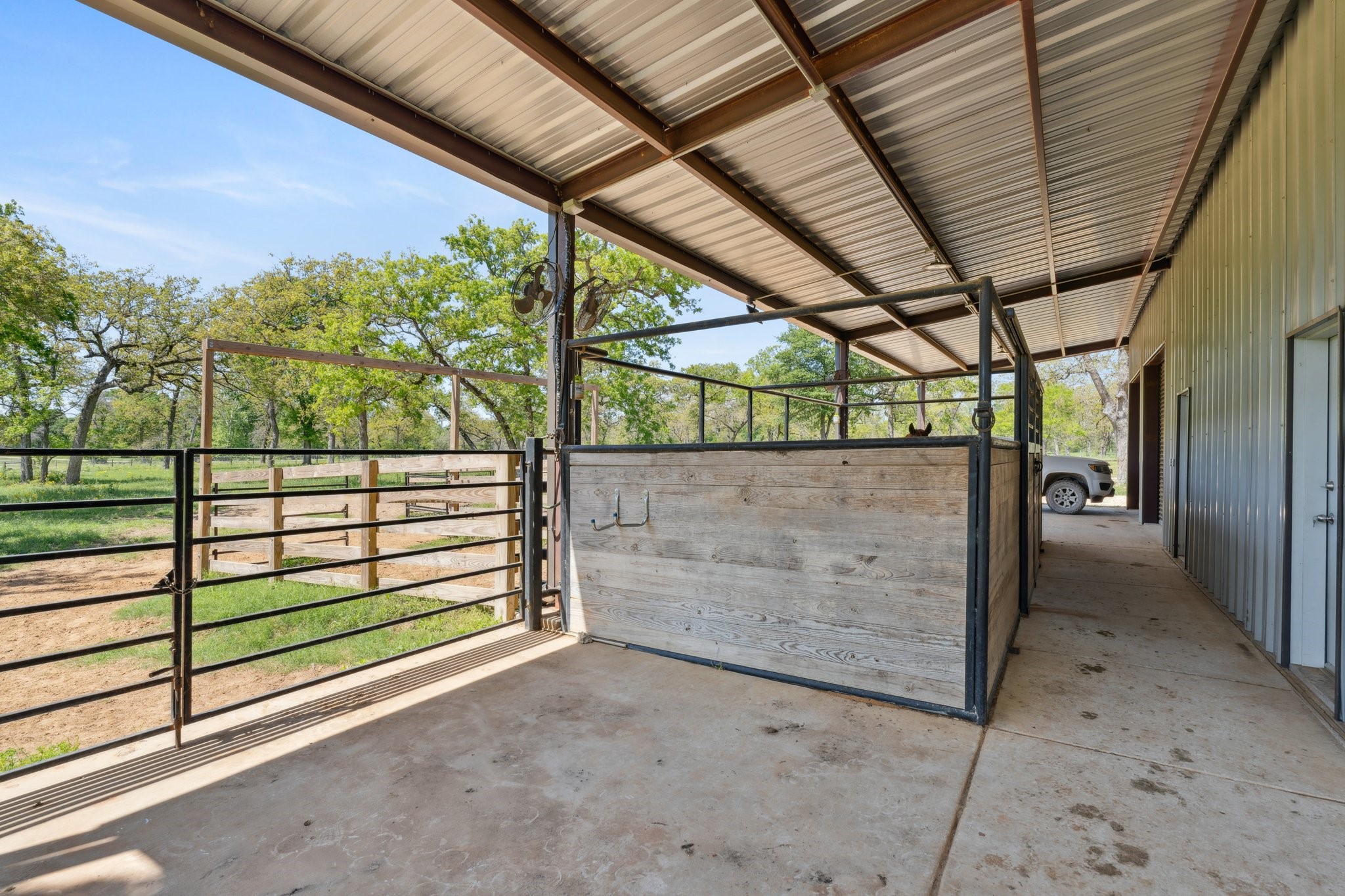 4052 Kuykendall Road Bellville, TX 77418 - Photo 31 of 40 2 tact rooms with horse stalls. And, the barn has a 16 foot roof extension. *As per seller.