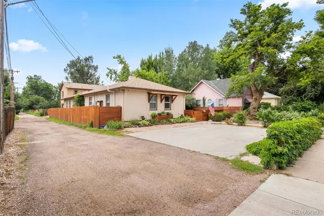 a view of a patio with table and chairs and potted plants