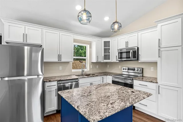 a view of kitchen island with wooden floor and window