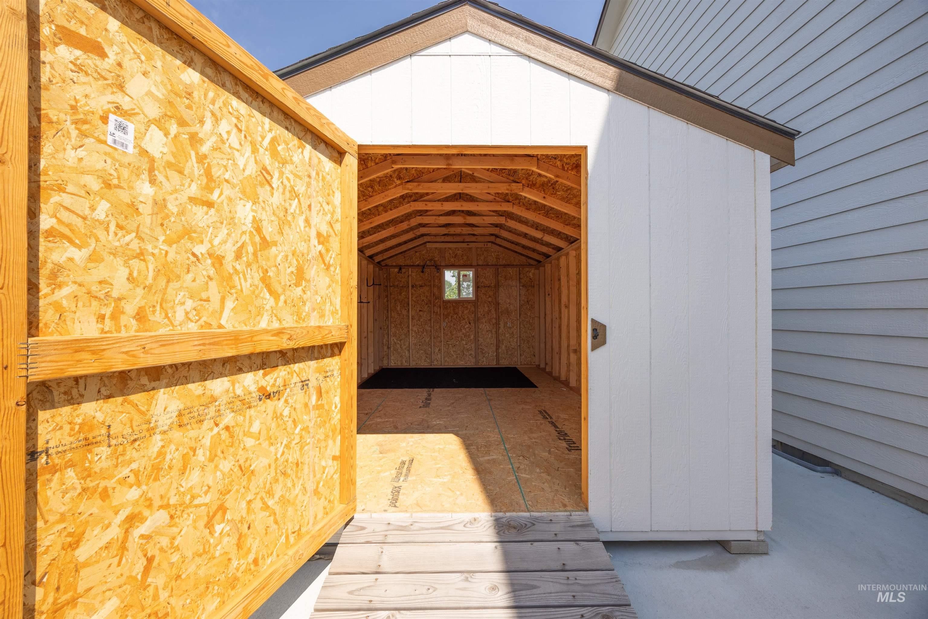 300 South Rocker Avenue Kuna, ID 83634 - Photo 36 of 49 Newly constructed storage shed featuring a spacious interior, wood-finish flooring, and a small window for natural light
