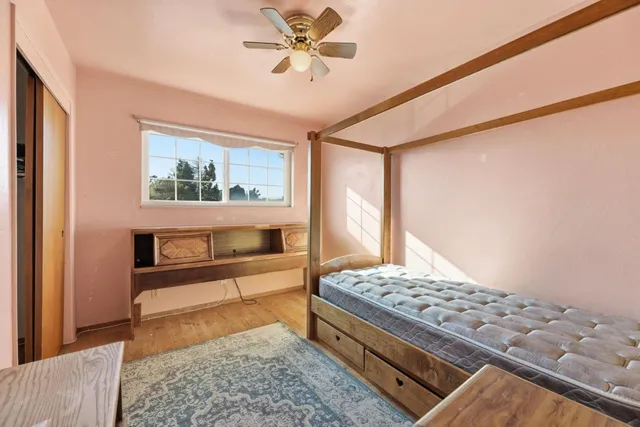 a living room with a couch and a rug