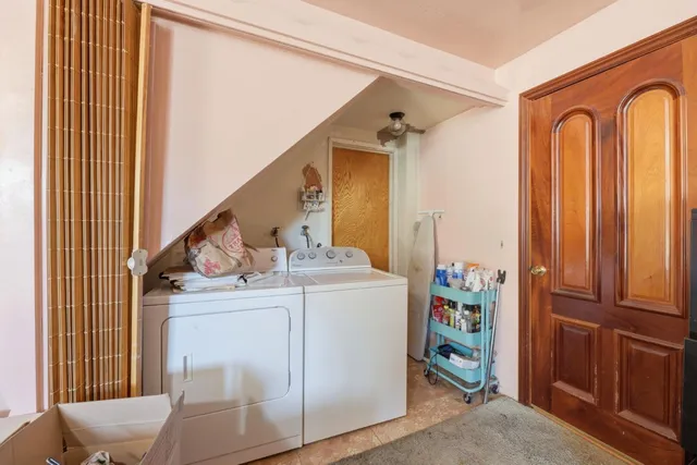a view of hallway with washer and dryer