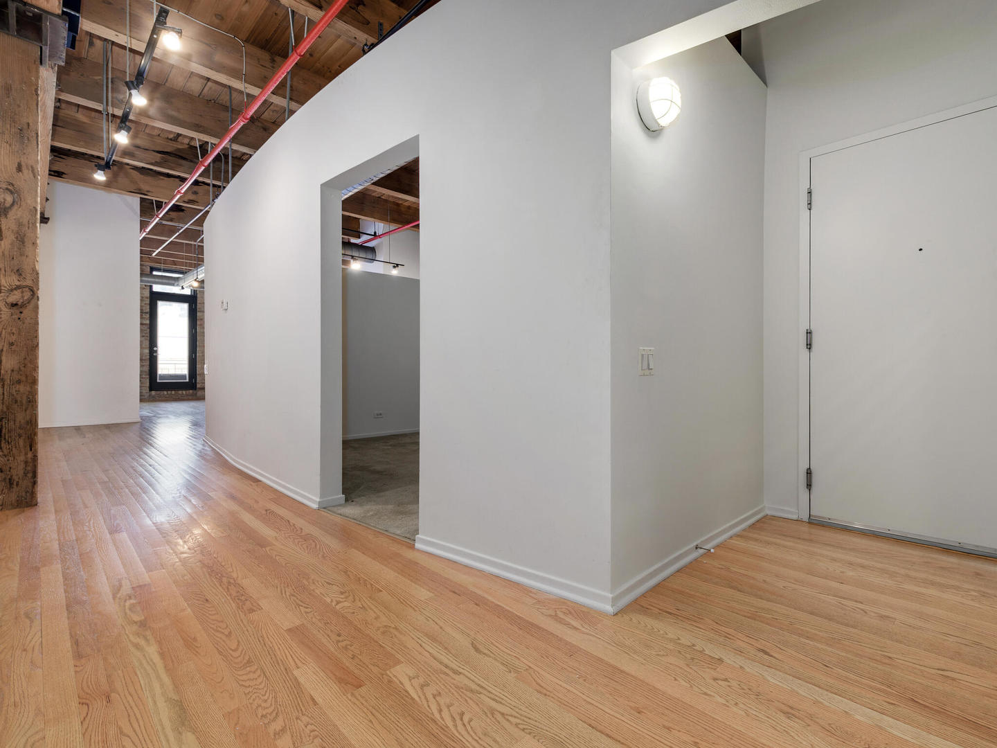 375 West Erie Street, Unit 508 Chicago, IL 60654 - Photo 10 of 16 a view of hallway with wooden floor