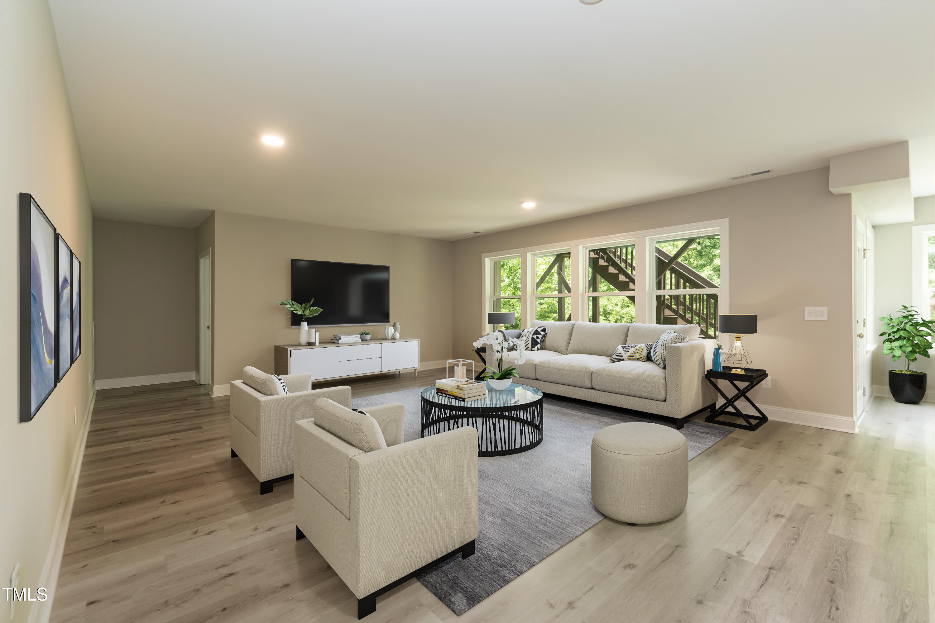273 Scarlet Tanager Circle Holly Springs, NC 27540 - Photo 27 of 35 a living room with furniture and a flat screen tv