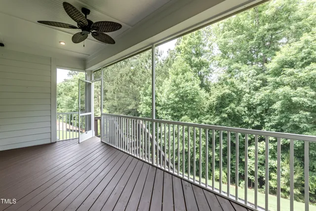 a view of a balcony with wooden floor