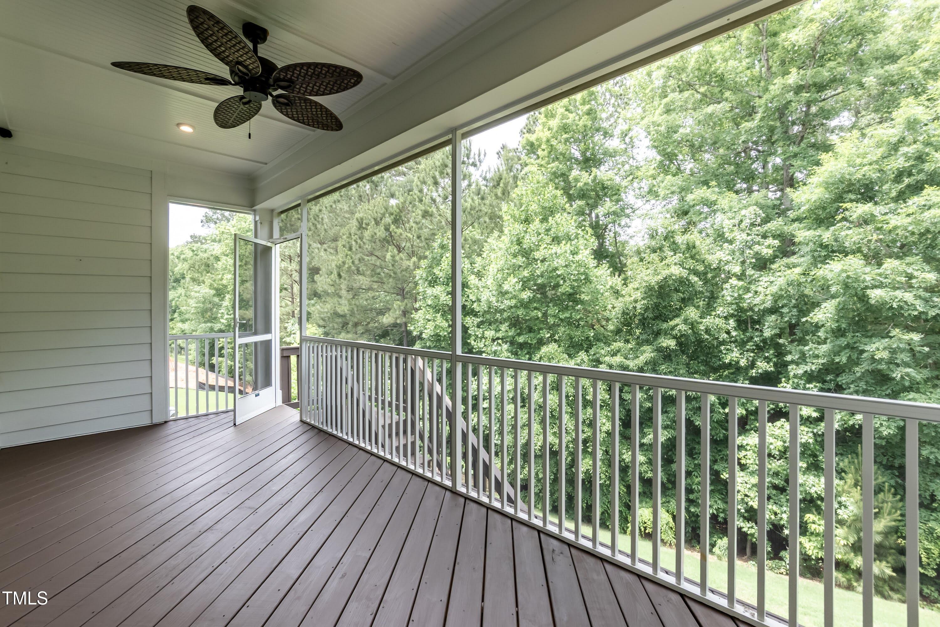 273 Scarlet Tanager Circle Holly Springs, NC 27540 - Photo 30 of 35 a view of a balcony with wooden floor
